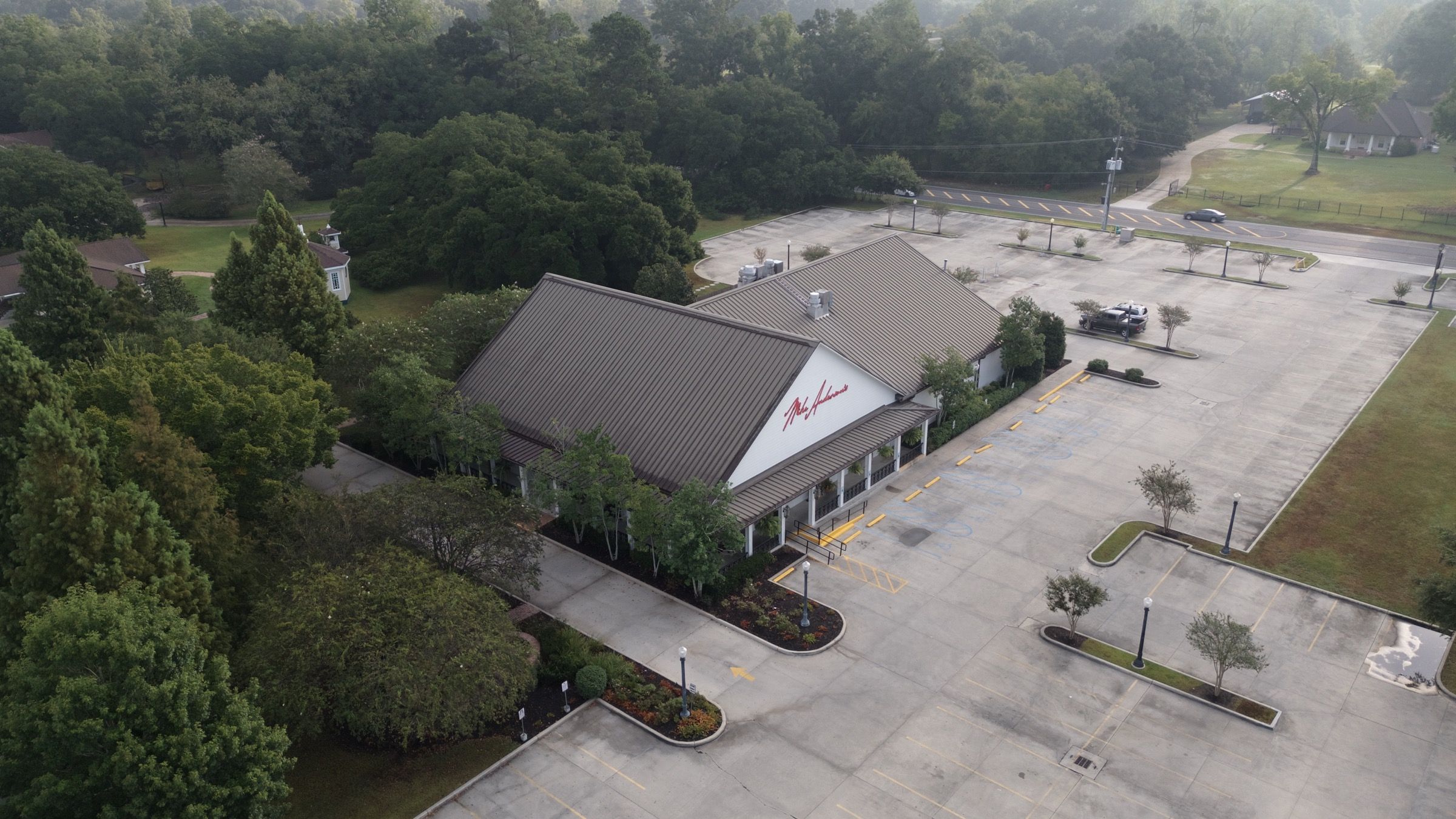 Mike Anderson's, aerial view of the restaurant, entry plantings, and parking lot