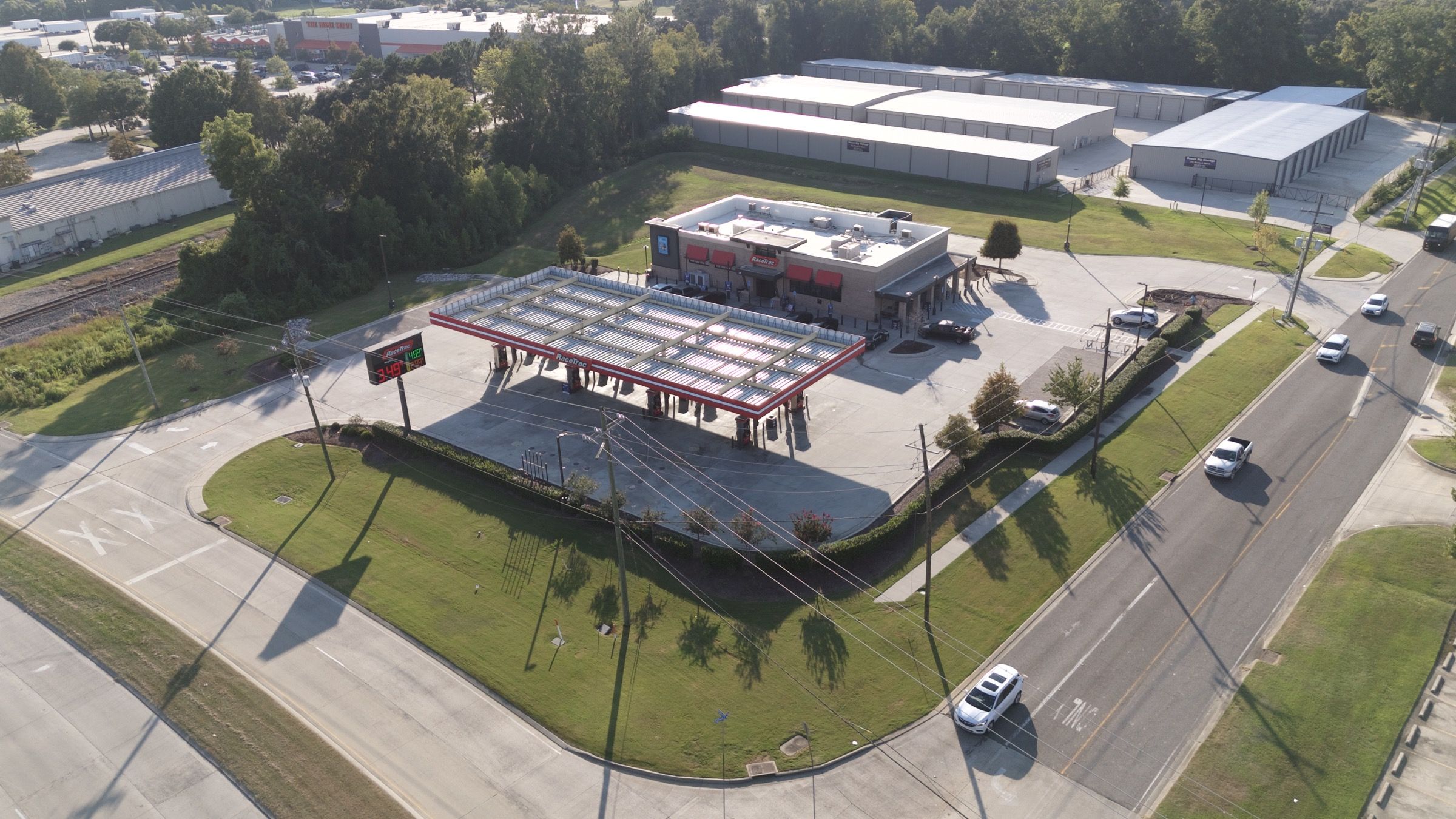 RaceTrac, aerial view of the store, fuel canopy, and roadside landscaping